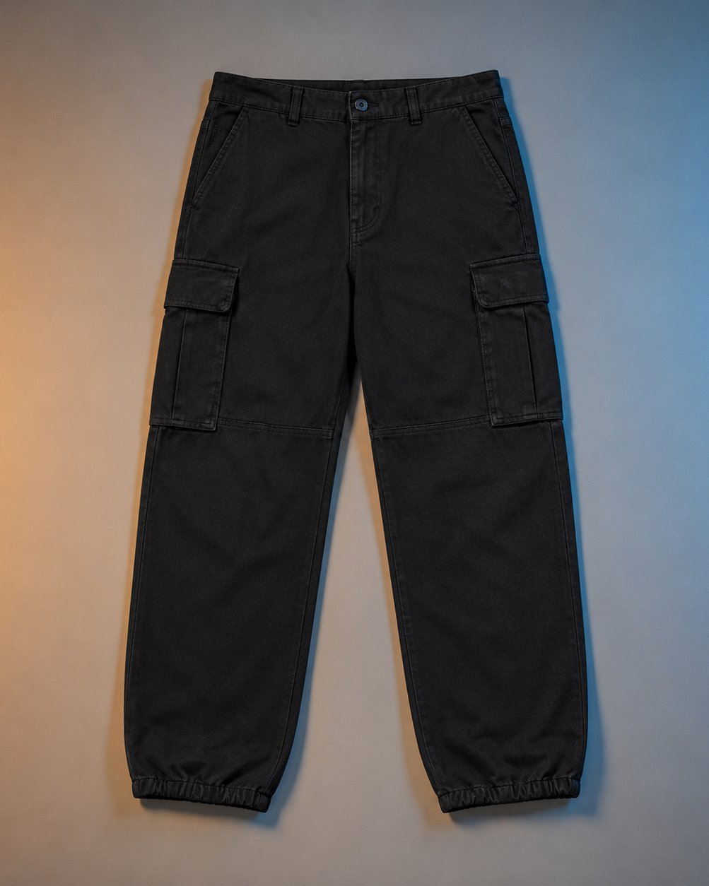 Joubify black wide-leg cargo pants flat lay showing utility flap pockets and elastic hems