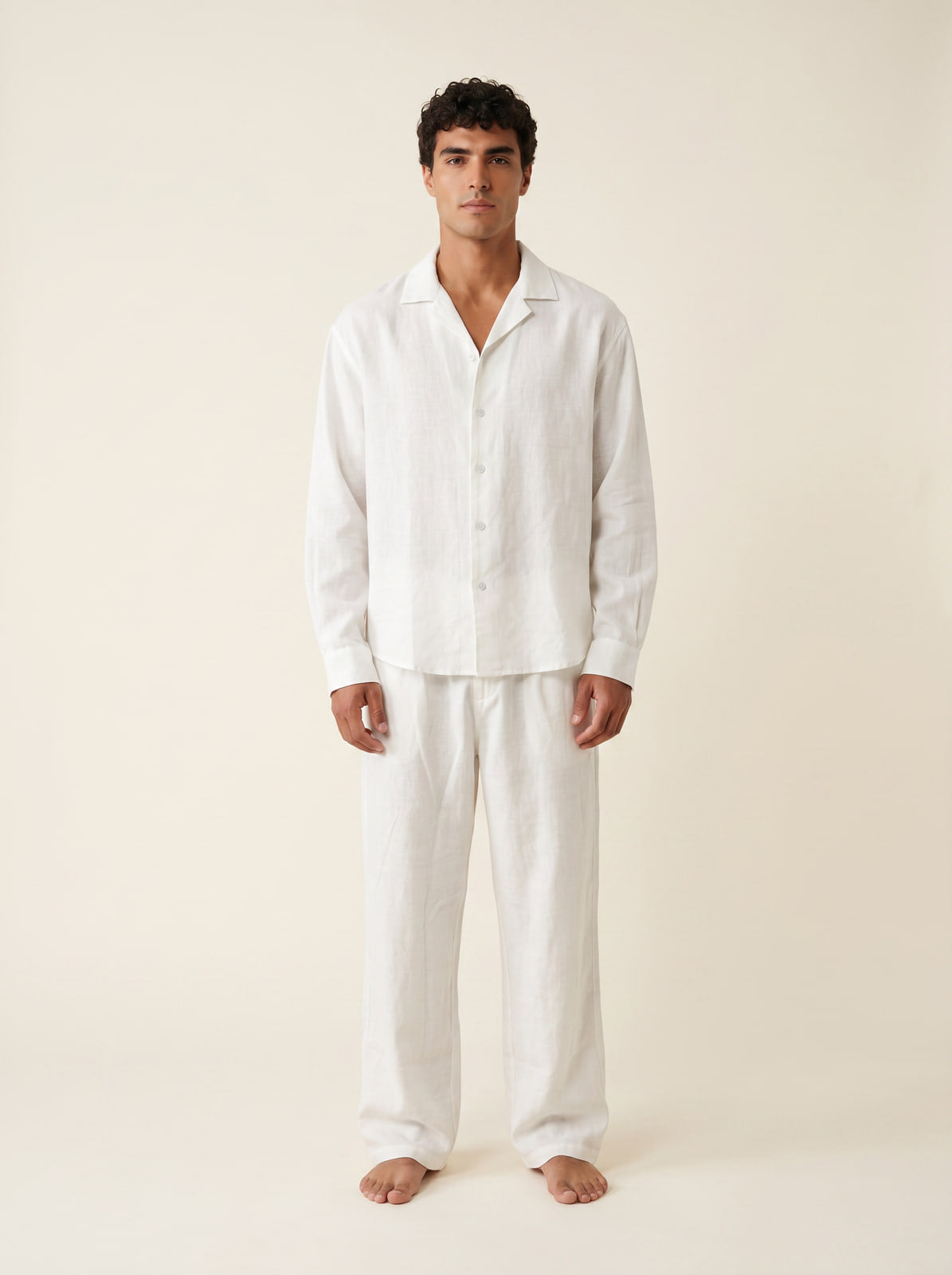 Joubie wearing the Joubify white linen outfit - camp-collar shirt and wide-leg drawstring trousers